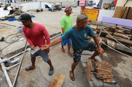people working on the yacht